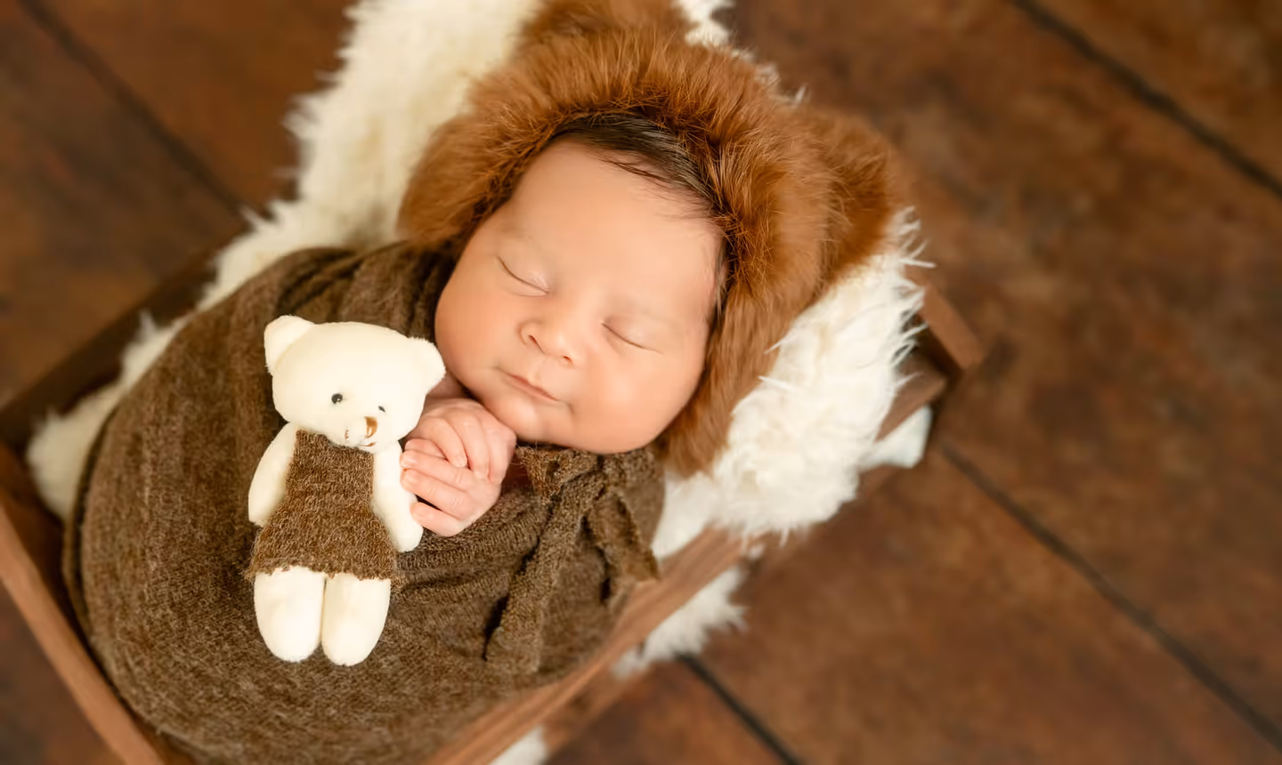 Sleeping newborn wrapped in a soft blanket